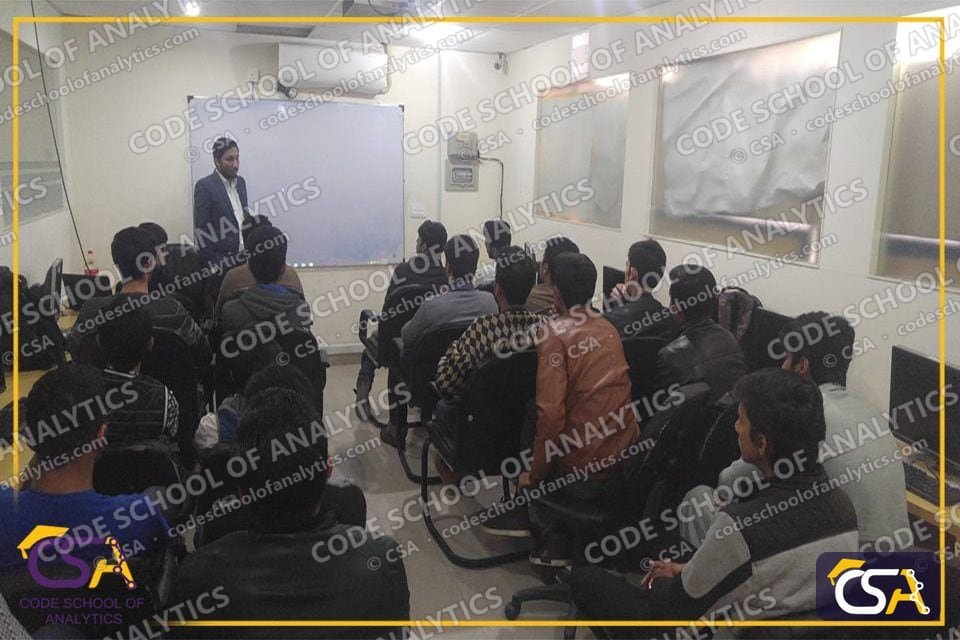Speaker presenting to a full CSA classroom