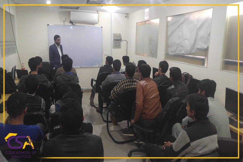 Speaker presenting to a full CSA classroom